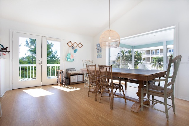 100 S Gulf Blvd, Placida, FL 33946 - dining space featuring french doors, plenty of natural light, light wood finished floors, and vaulted ceiling
