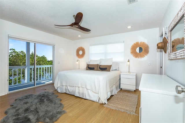 100 S Gulf Blvd, Placida, FL 33946 - bedroom with access to exterior, multiple windows, light wood finished floors, ceiling fan, and recessed lighting