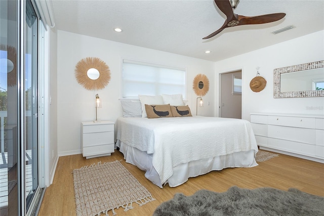 100 S Gulf Blvd, Placida, FL 33946 - bedroom featuring wood finished floors, recessed lighting, and a ceiling fan