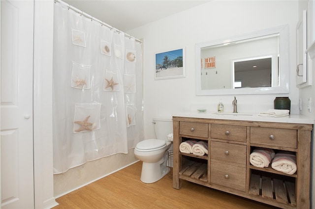 100 S Gulf Blvd, Placida, FL 33946 - bathroom with wood finished floors, vanity, and shower / bathtub combination with curtain