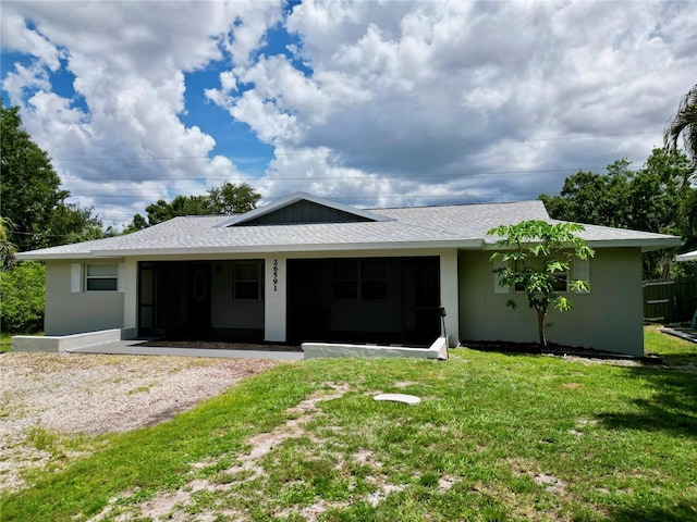26591 Fairway Dr Unit A & B, Punta Gorda, FL 33982 - back of property with a lawn and stucco siding