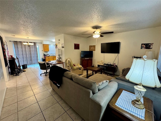 26591 Fairway Dr Unit A & B, Punta Gorda, FL 33982 - living room with a textured ceiling, a chandelier, light tile patterned floors, and ceiling fan