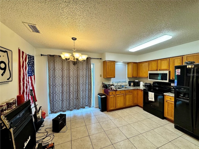 26591 Fairway Dr Unit A & B, Punta Gorda, FL 33982 - kitchen featuring black appliances, a chandelier, brown cabinets, light tile patterned flooring, and a textured ceiling
