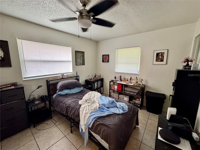 26591 Fairway Dr Unit A & B, Punta Gorda, FL 33982 - bedroom featuring light tile patterned flooring, a textured ceiling, and ceiling fan