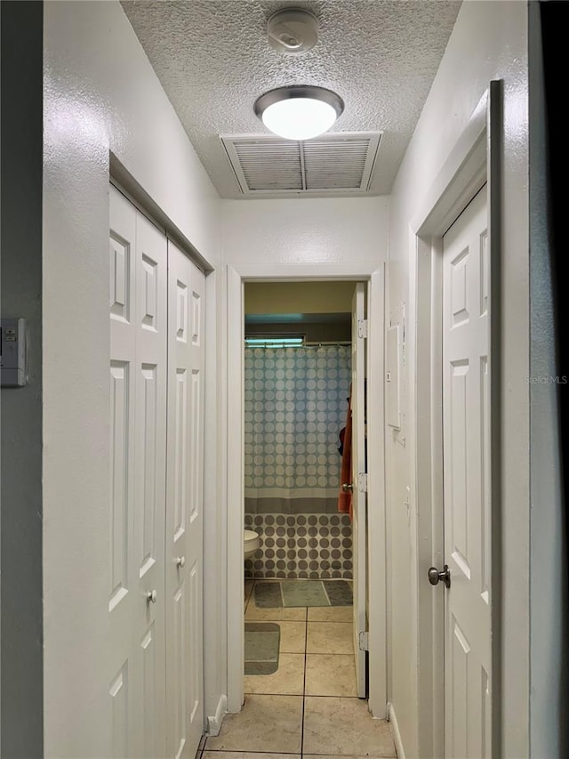 26591 Fairway Dr Unit A & B, Punta Gorda, FL 33982 - hallway featuring a textured ceiling
