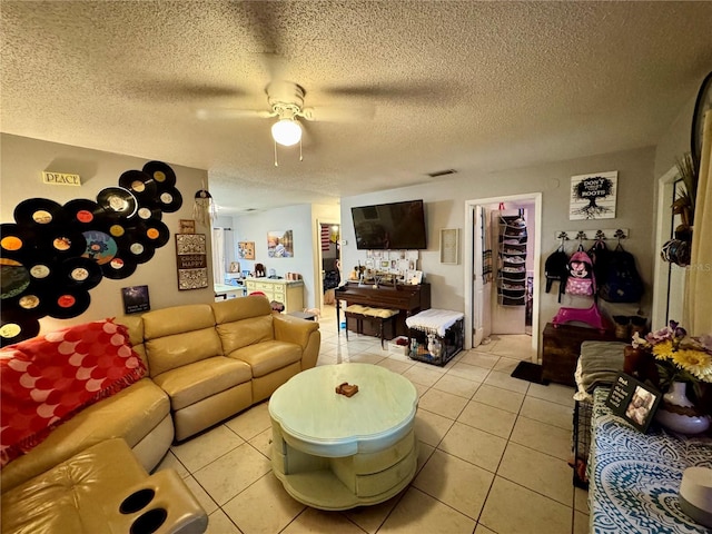 26591 Fairway Dr Unit A & B, Punta Gorda, FL 33982 - living room featuring ceiling fan, a textured ceiling, and light tile patterned floors