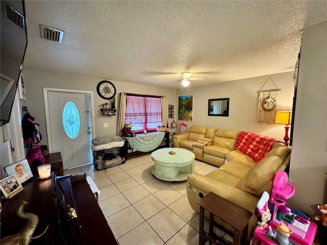 26591 Fairway Dr Unit A & B, Punta Gorda, FL 33982 - living area with light tile patterned floors, a textured ceiling, ceiling fan, and plenty of natural light