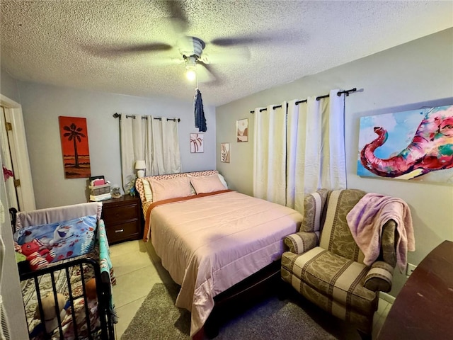 26591 Fairway Dr Unit A & B, Punta Gorda, FL 33982 - bedroom with a textured ceiling, ceiling fan, and light tile patterned floors