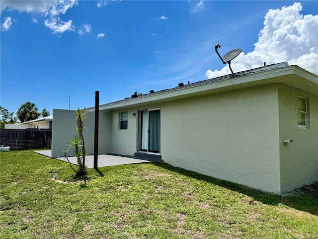 26591 Fairway Dr Unit A & B, Punta Gorda, FL 33982 - back of house featuring stucco siding and a patio