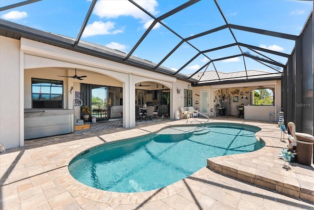 15044 San Domingo Blvd, Port Charlotte, FL 33981 - outdoor pool with a ceiling fan, a patio area, glass enclosure, and outdoor dining area