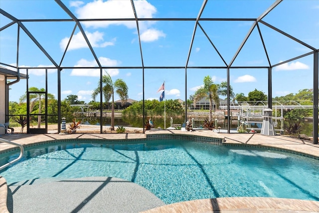 15044 San Domingo Blvd, Port Charlotte, FL 33981 - swimming pool featuring a lanai, boat lift, a dock, and a water view