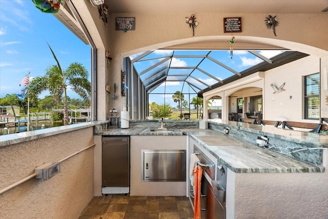 15044 San Domingo Blvd, Port Charlotte, FL 33981 - view of patio / terrace with glass enclosure and exterior kitchen