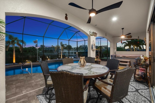 15044 San Domingo Blvd, Port Charlotte, FL 33981 - view of patio with ceiling fan, an outdoor pool, glass enclosure, and outdoor dining space