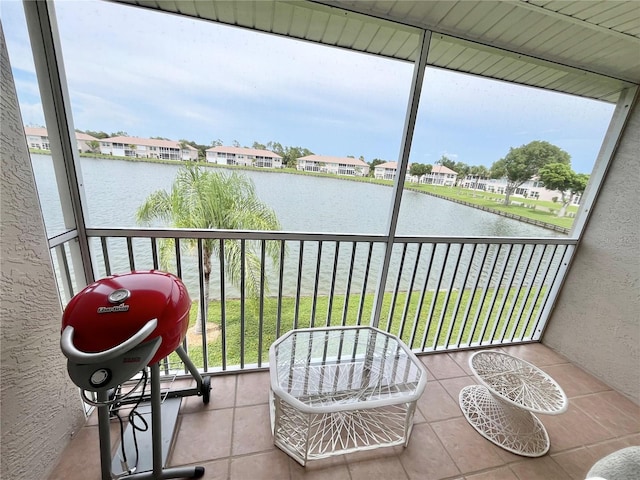 11644 SW Egret Cir Unit 905, Lake Suzy, FL 34269 - balcony featuring a water view, a residential view, and area for grilling
