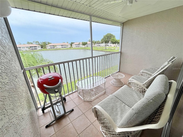 11644 SW Egret Cir Unit 905, Lake Suzy, FL 34269 - balcony featuring a water view and ceiling fan
