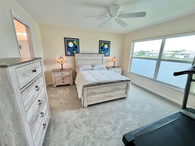 11644 SW Egret Cir Unit 905, Lake Suzy, FL 34269 - bedroom with light carpet and a ceiling fan