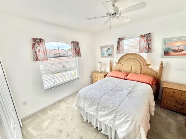 11644 SW Egret Cir Unit 905, Lake Suzy, FL 34269 - bedroom with light carpet and ceiling fan