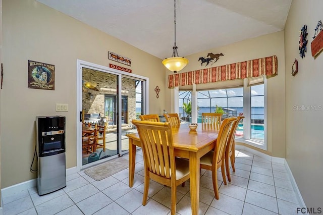 tiled dining space with a healthy amount of sunlight