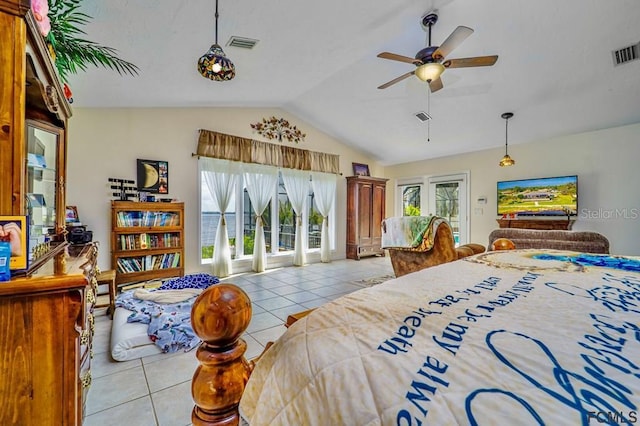 bedroom featuring lofted ceiling, access to exterior, and light tile patterned floors