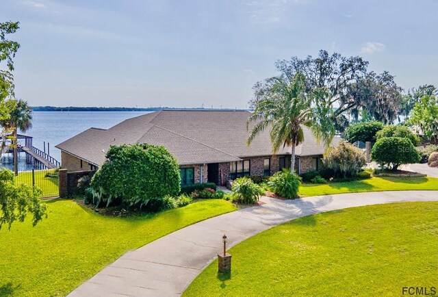 view of front of property with a water view and a front yard