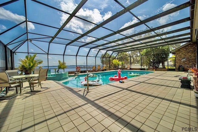 view of pool with a patio and a lanai