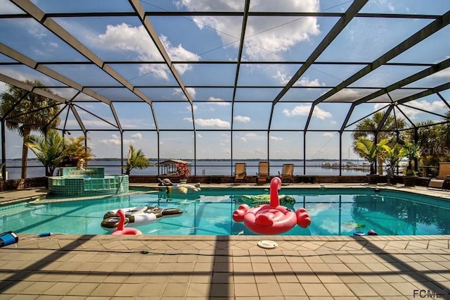 view of swimming pool featuring an in ground hot tub, a patio, and glass enclosure