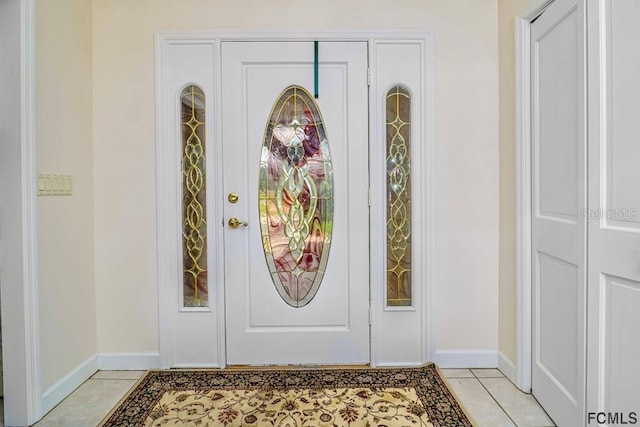 foyer entrance featuring light tile patterned floors