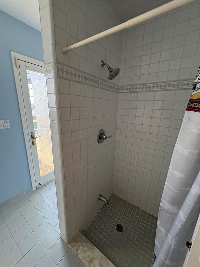 bathroom featuring a shower with curtain and tile patterned floors