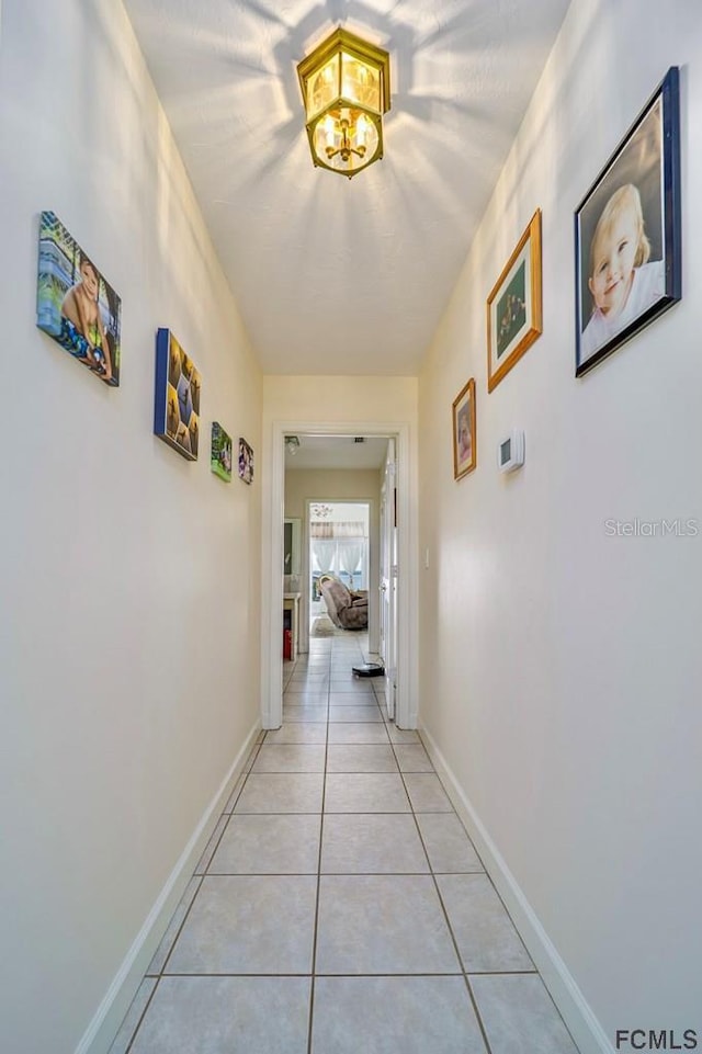 hallway featuring light tile patterned floors