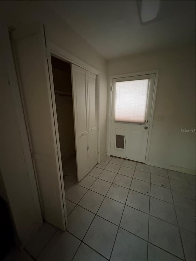 interior space featuring light tile patterned flooring