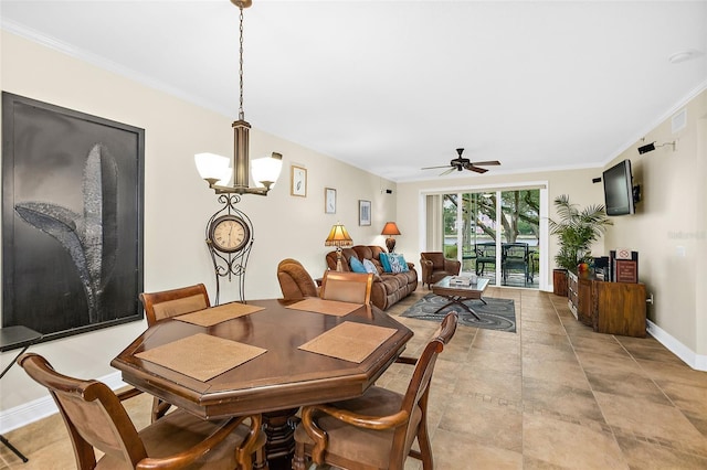 dining area featuring ceiling fan with notable chandelier and ornamental molding