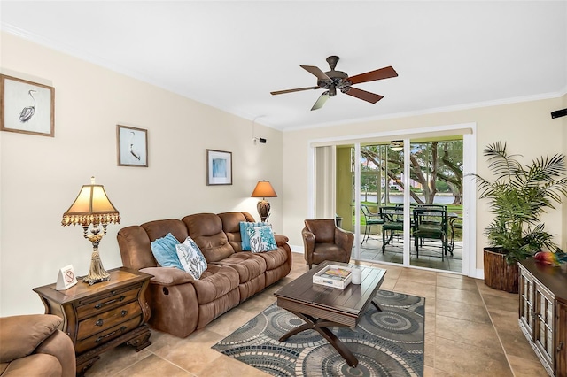 living room featuring ceiling fan, ornamental molding, and light tile patterned floors