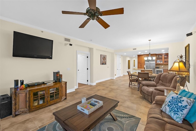 living room featuring light tile patterned flooring and ceiling fan