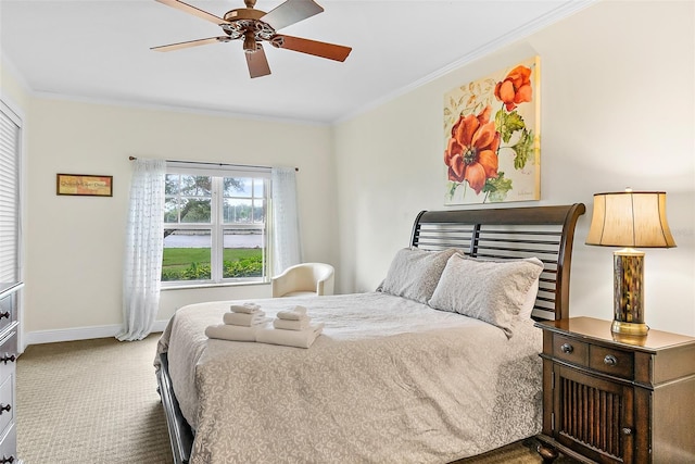 bedroom with carpet floors, ornamental molding, and ceiling fan