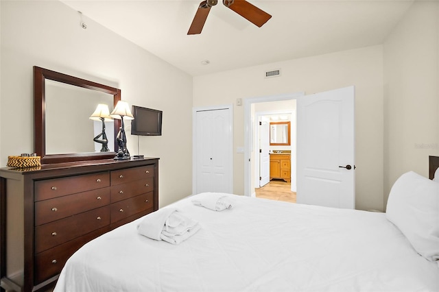 bedroom with ceiling fan and connected bathroom