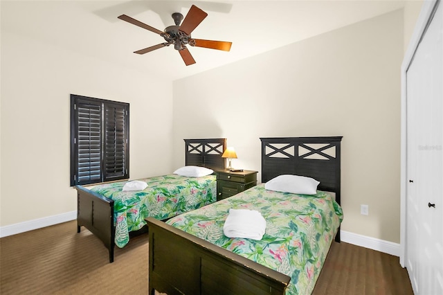 bedroom featuring hardwood / wood-style floors, ceiling fan, and a closet