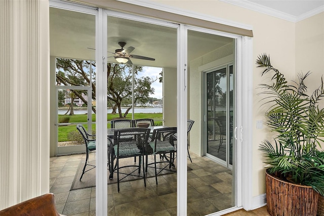 exterior space with ceiling fan and a patio