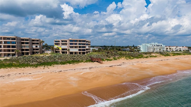 view of nearby features featuring a water view and a view of the beach