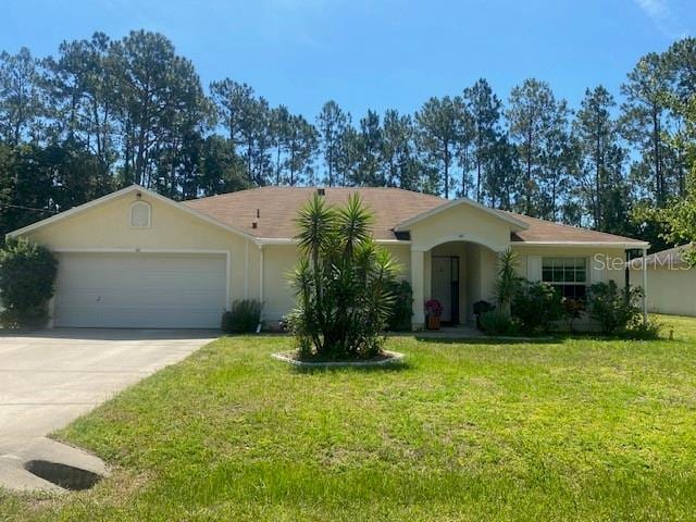 ranch-style home with a front lawn and a garage