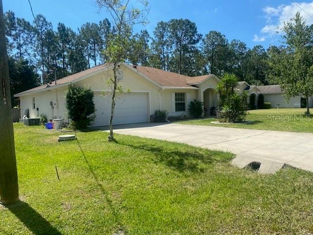 single story home with a front lawn and a garage