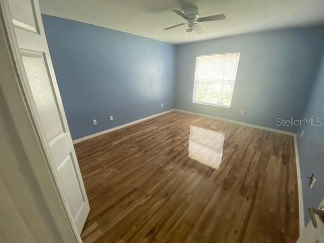 unfurnished room featuring wood-type flooring and ceiling fan