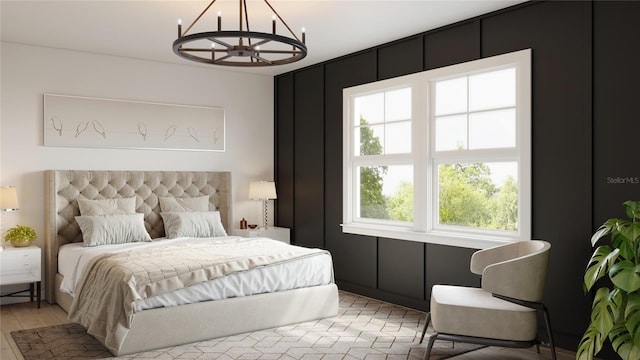 bedroom with an inviting chandelier and light hardwood / wood-style floors