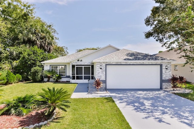 ranch-style home featuring a front yard and a garage