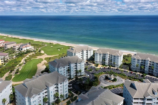 drone / aerial view with a water view and a view of the beach