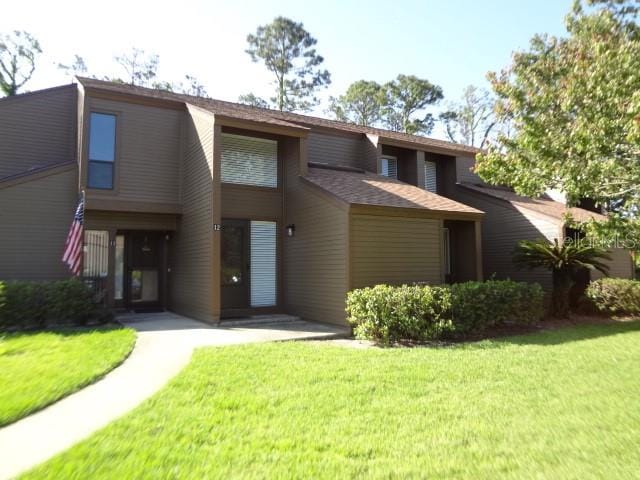 view of front of home with a front lawn