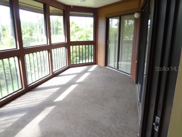 unfurnished sunroom with a wealth of natural light