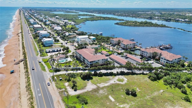 bird's eye view with a beach view and a water view