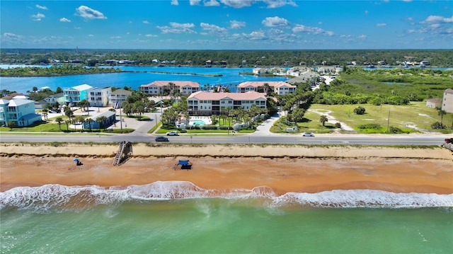 drone / aerial view with a view of the beach and a water view