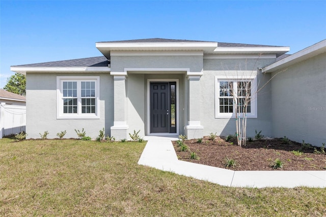 view of front of home with a front lawn