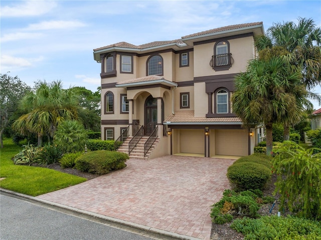 mediterranean / spanish-style house featuring a garage